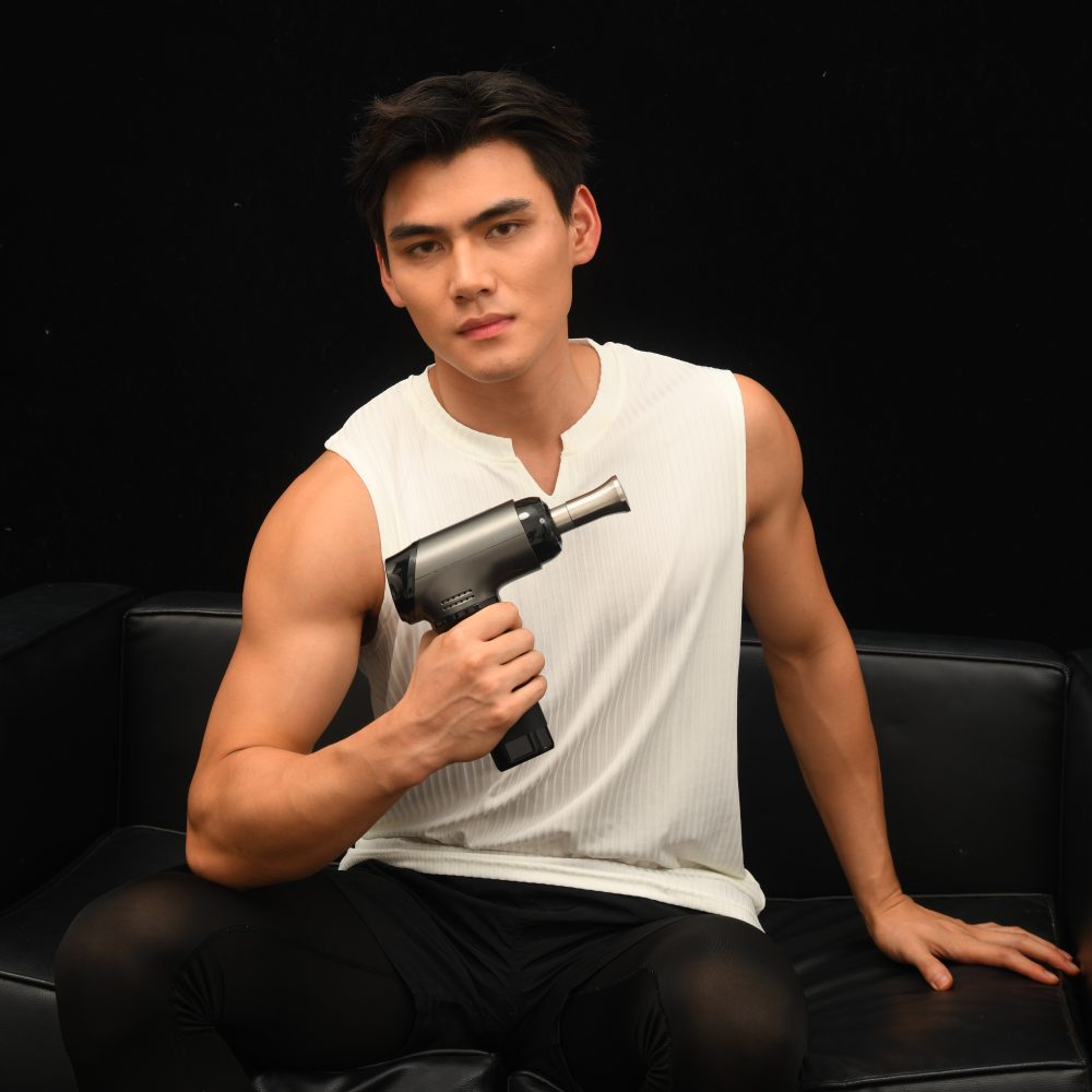 Man with TiPRO MAX Adjustable Amplitude Massage Gun